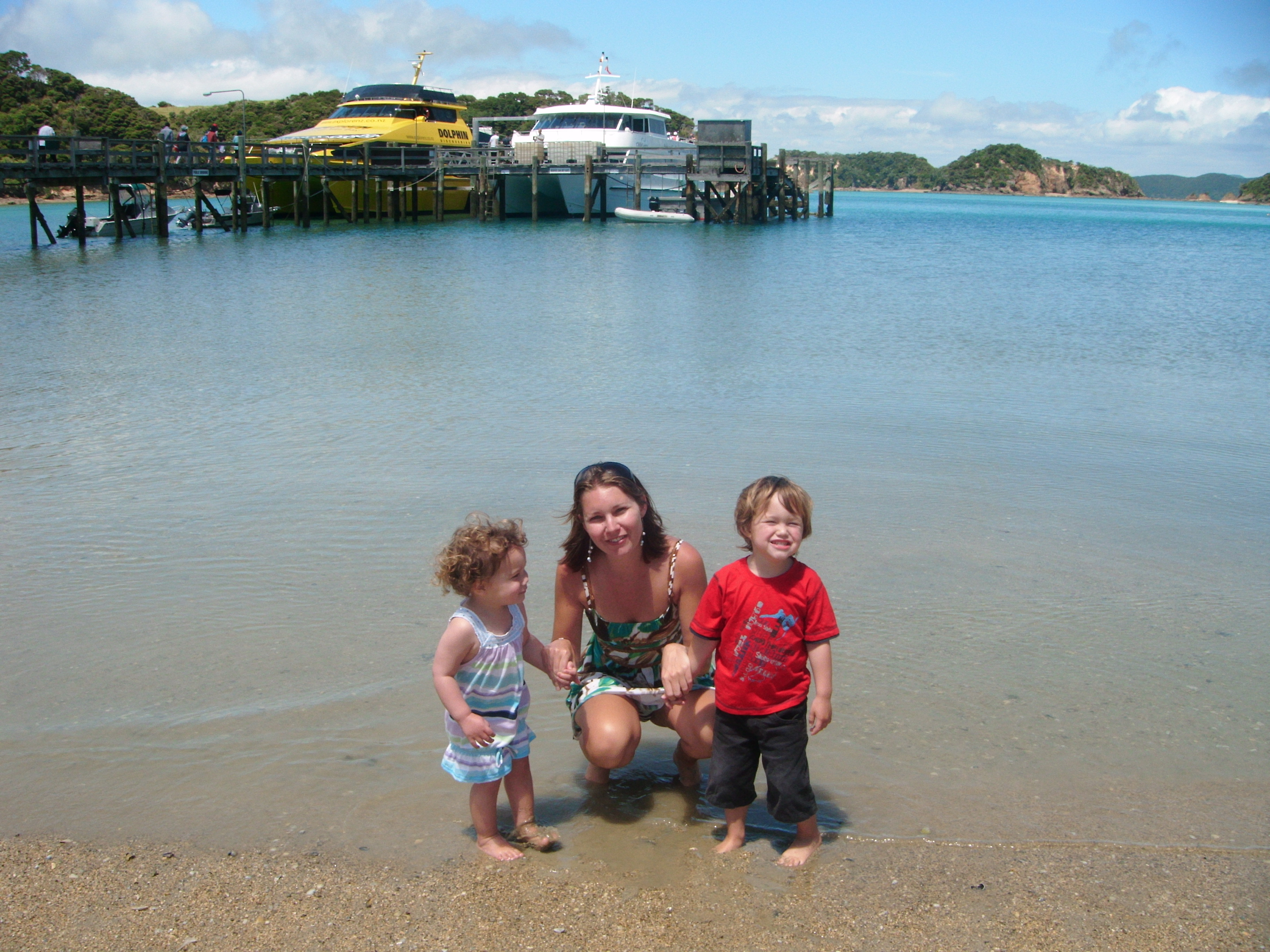 Melissa Wiringi with her kids on the beach in the Bay of Islands